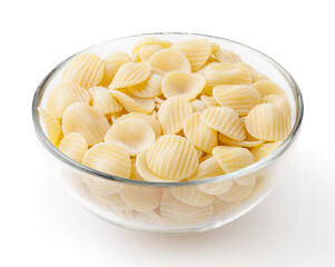 Uncooked orecchiette pasta in glass bowl isolated on white background with clipping path