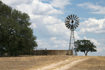 windmill and water tank in Texas hill country