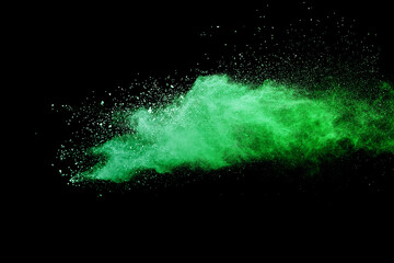 Fototapeta na wymiar Green powder explosion on black background.