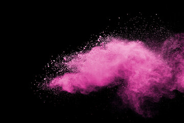 Pink powder explosion on black background. Paint Holi.
