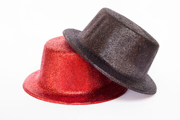 Black and red glitter party hat isolated on a white background.