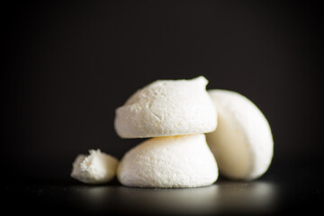 sweet tasty white meringues with a burlap tablecloth