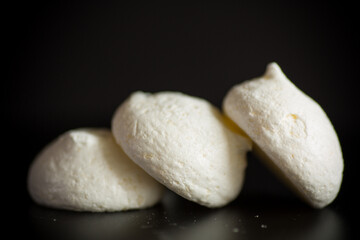 sweet tasty white meringues with a burlap tablecloth