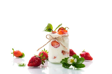 sweet homemade yogurt with ripe fresh strawberries in a jar