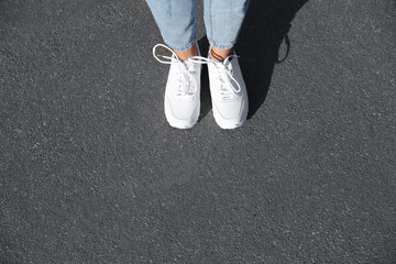 Plakat Woman standing outdoors, top view with space for text. Choosing way concept.