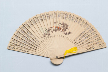 Fan a hand waving back and forth. Fold-able easy to carry when you go which is likely to come from...