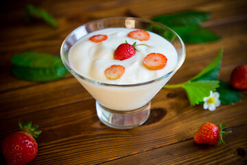 sweet homemade yogurt with red ripe fresh strawberries