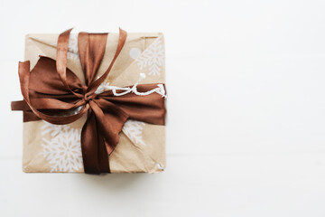 Christmas style rustic brown paper gift bow with brown bow