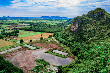 Fototapeta na wymiar High angle view around Khao Chong Sadet Kanchanaburi Thailand, Green rural area under blue sky