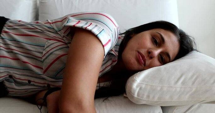 Woman lying in sofa to rest. exhausted girl lies on ouch