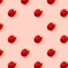 Children birthday party and holiday concept with Ladybug sweet yummy colorful fancy cake seamless pattern against pink background. One fancy cake missing, empty space. 