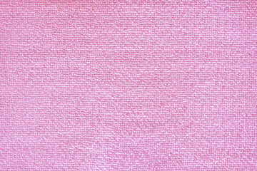 Cleaning microfiber pattern. Pink polyester microfibre texture. Synthetic fiber material Cleaning cloth for dust or kitchen top view closeup