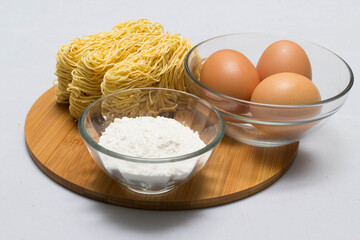 Raw homemade Egg noodles and ingredients for Egg noodles