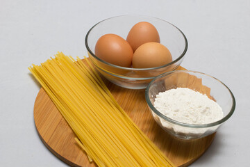 Raw homemade Egg noodles and ingredients for Egg noodles