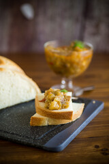 cooked eggplant caviar with spices on a wooden table