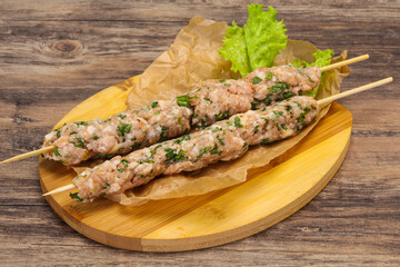 Raw minced pork skewer kebab for grill