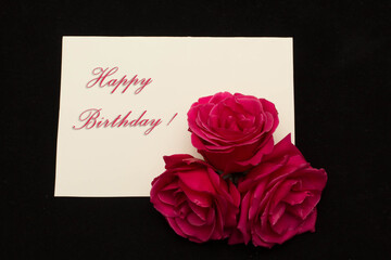 Roses and card Happy birthday - holiday background