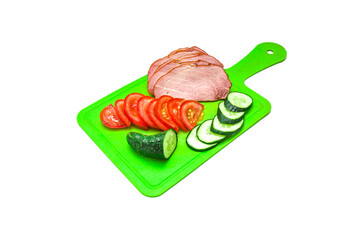 Smoked meat with vegetables on a cutting board