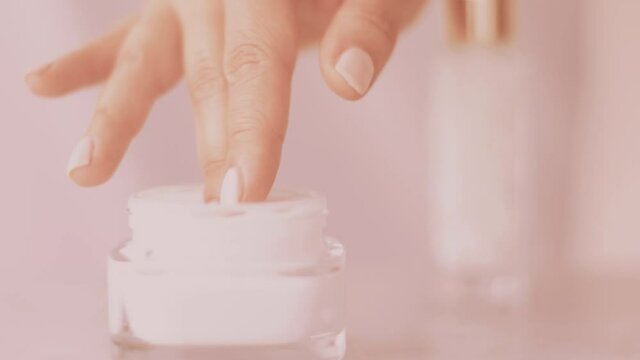 Woman and her morning skincare routine, female hand applying moisturizing cream or body lotion for healthy skin, organic cosmetic product and luxury beauty brand, stock footage