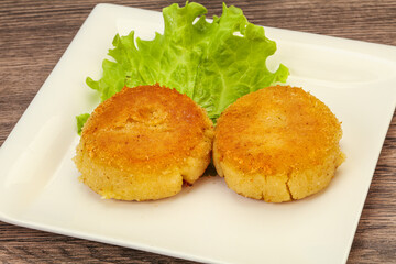 Vegan cuisine - Potato cutlet in the plate