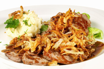 Grilled Striploin Beef Slices with fried Onions - Isolated on white Background