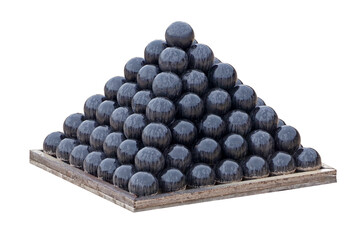 A pyramid of black cannonballs on a white