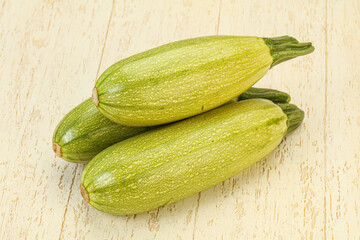Young tasty zucchini over board