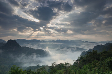Morning mist above mountain againts sky