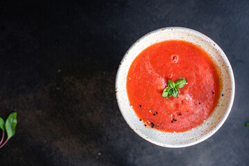 tomato soup gazpacho in a plate on the table tasty serving size portion top view copy space for text keto or paleo diet