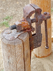 old rusty vise on a pole