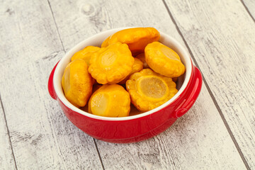 Marinated yellow patisson in the bowl