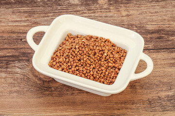 Raw buсkwheat cereal in the bowl