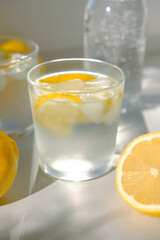 Water from lemons in a glass. Water balance in the body
