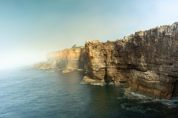 Fototapeta na wymiar the sea breaking against the cliffs