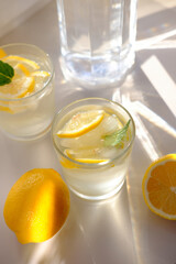Water from lemons in a glass. Water balance in the body