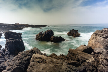 waves crashing against the rocks