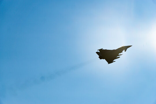 Typhoon Aircraft flying through the sun