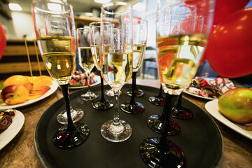 buffet - champagne glasses are on a tray