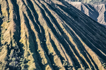 Batok volcano beautiful mountain range wave pattern surface in Tengger caldera near Bromo. Batok is part of Bromo Tengger Semeru National Park. Batok is a cinder cone volcano in East Java,Indonesia.