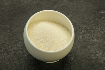 White sugar in the bowl