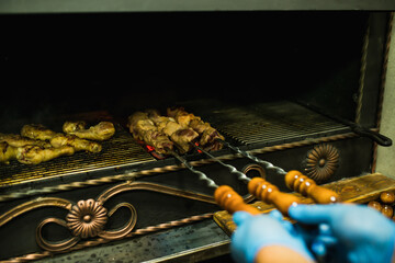shish kebab strung on a skewer is fried in the grill