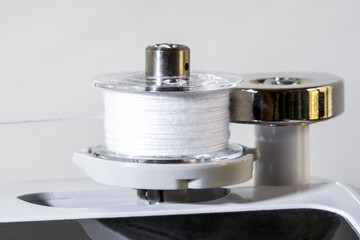Sewing Machine Bobbin Winder and White Thread