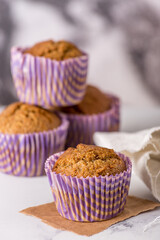 Sweet cakes or cupcakes on light marble background. Holiday cake celebration, delicious dessert, close up