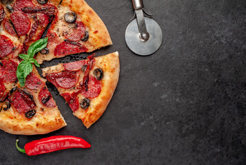 pepperoni pizza with salami sausages, mozzarella, olives, Provencal herbs, signature tomato sauce...
