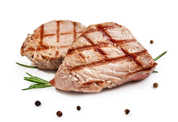 Two grilled tuna steak with rosemary and spices isolated on white