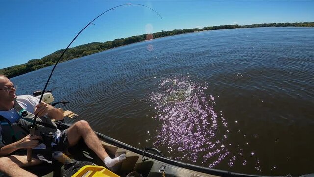 Man hook up and lost Large Mouth Bass while fishing from kayak and being recorded by other man..