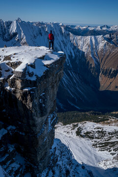 Male hiker standing at edge of Namloser Wetterspitze peak