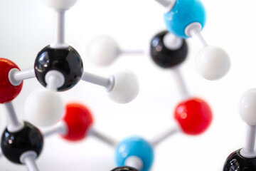 Selective focus of science molecular model structure on white background