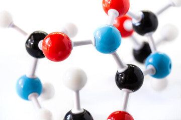 Selective focus of science molecular model structure on white background