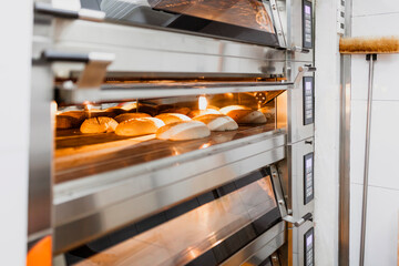 Bread baking bread in oven at commercial kitchen